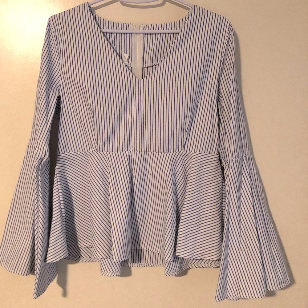 Bell sleeve peplum top. Medium